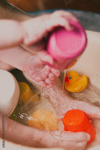 White caucasian Toddler taing a bath feet close up top view colorfull shot photo