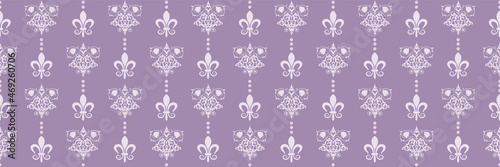 Cute background image in Indian style with floral decorative elements on purple backdrop for your design. Seamless background for wallpaper, textures.