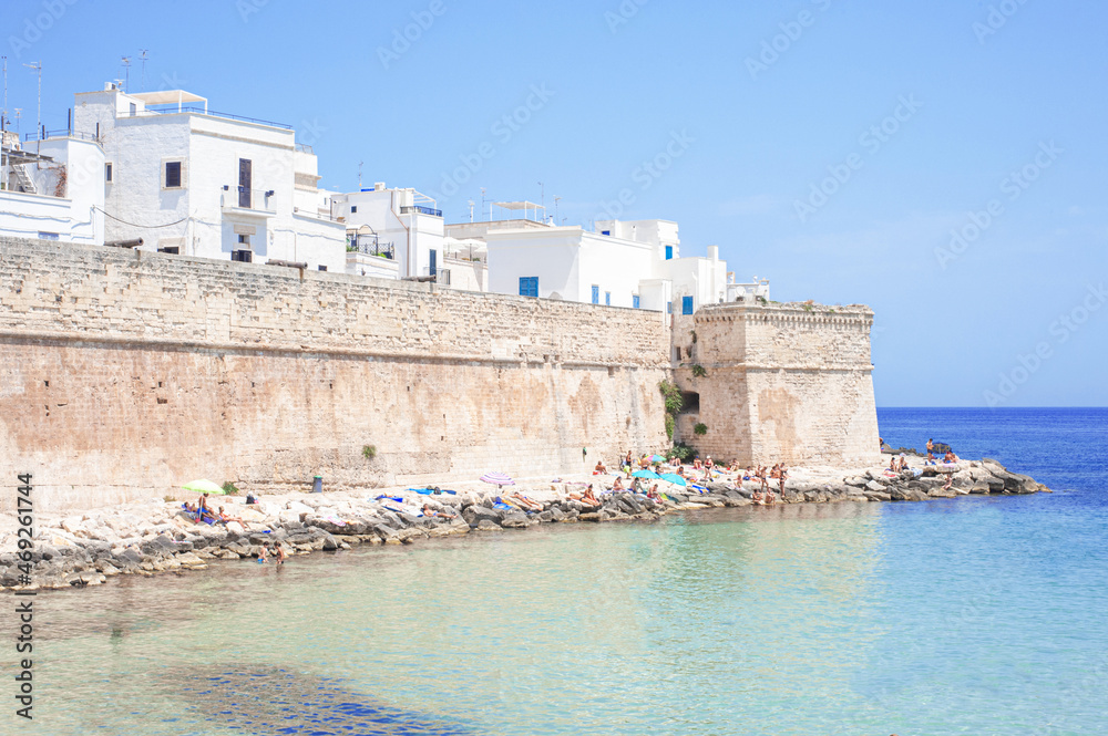 city walls turning into cliffs in the bay of Monopoli