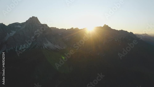 Aerial view of Punta Tre Scarperi Peak in italian Sesto Dolomites during sunrise photo