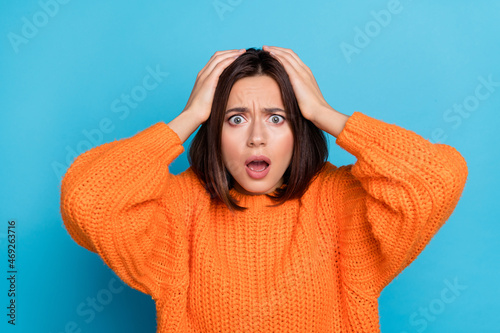Portrait of attractive overwhelmed desperate girl bad news reaction fail isolated over bright blue color background photo
