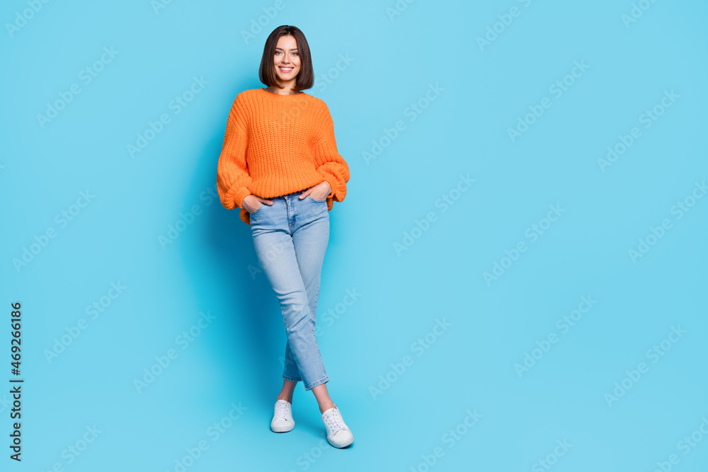 Full length body size view of attractive cheerful girl posing copy empty space isolated over bright blue color background Full length body size view of attractive cheerful girl posing copy empty space isolated over bright blue color background