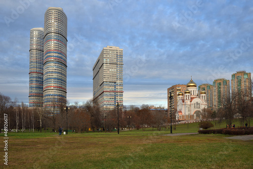 High-rise buildings and Church of Cyril and Methodius in Rostokino near Aqueduct park in autumn, Moscow, Russia