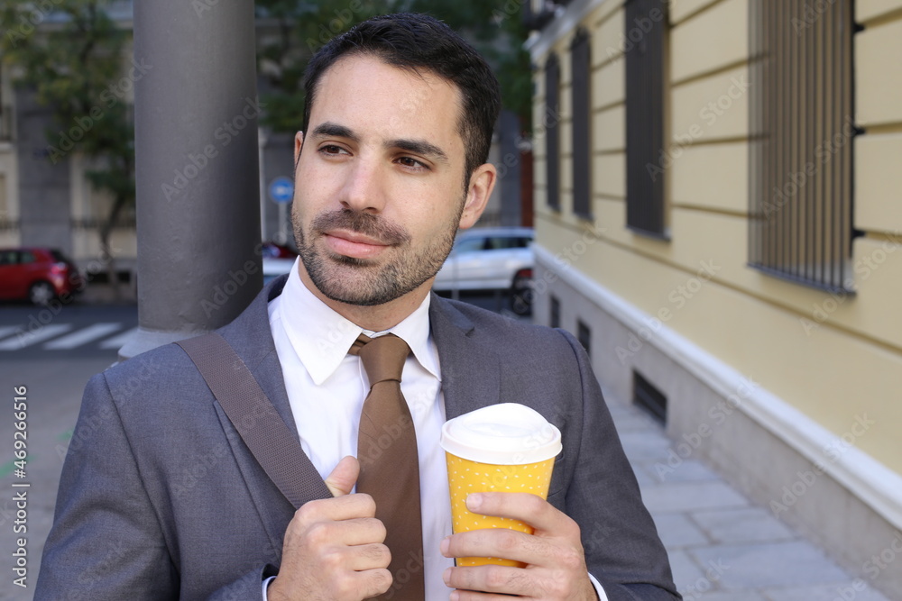 Fototapeta premium Elegant businessman with coffee to go