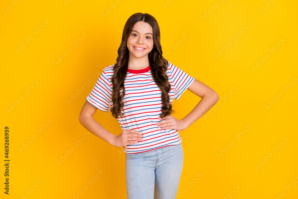 Photo of young attractive cheerful girl happy positive smile wear casual outfit isolated over yellow color background Photo of young attractive cheerful girl happy positive smile wear casual outfit isolated over yellow color background