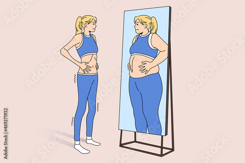 Unwell skinny girl look in mirror see fat obese reflection. Upset thin slim woman suffer from eating disorder. Female struggle with anorexia or bulimia. Mental health problem. Vector illustration. photo