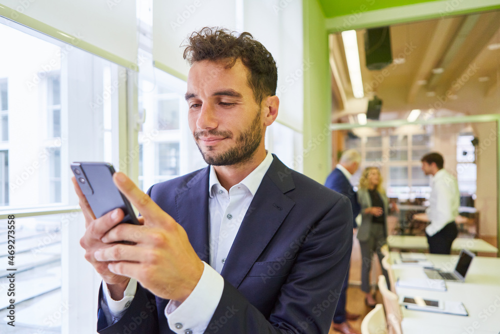 Business man using smartphone during video chat Business man using smartphone during video chat