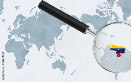 Asia centered world map with magnified glass on Venezuela. Focus on map of Venezuela on Pacific-centric World Map.
