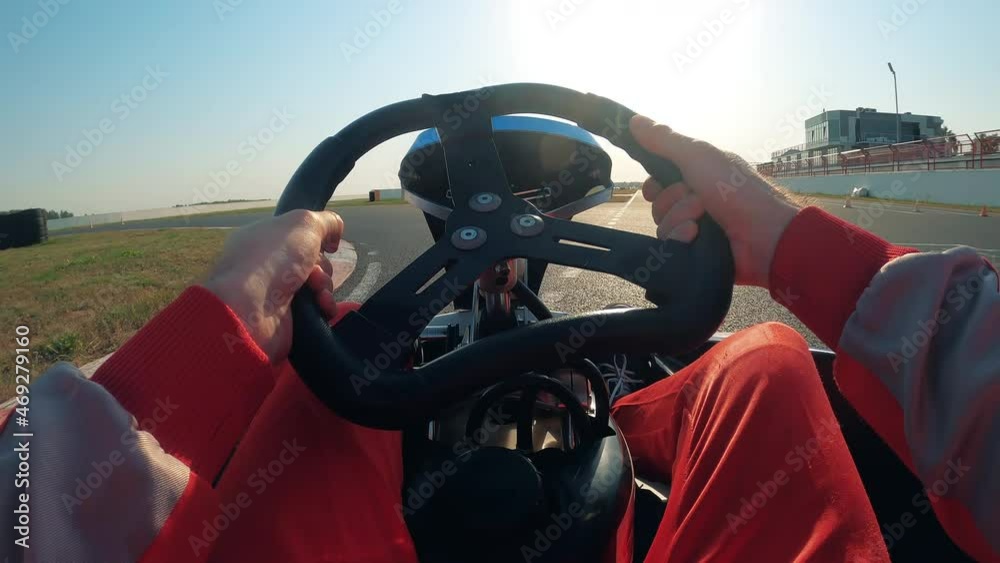 Wheel of a go-cart being controlled by a racer