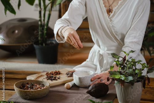 Принти на полотні Cacao ceremony in atmospheric space with green plants and candles