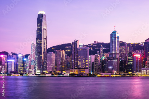 Hong Kong skyline cityscape downtown skyscrapers over Victoria Harbour in the dusk.