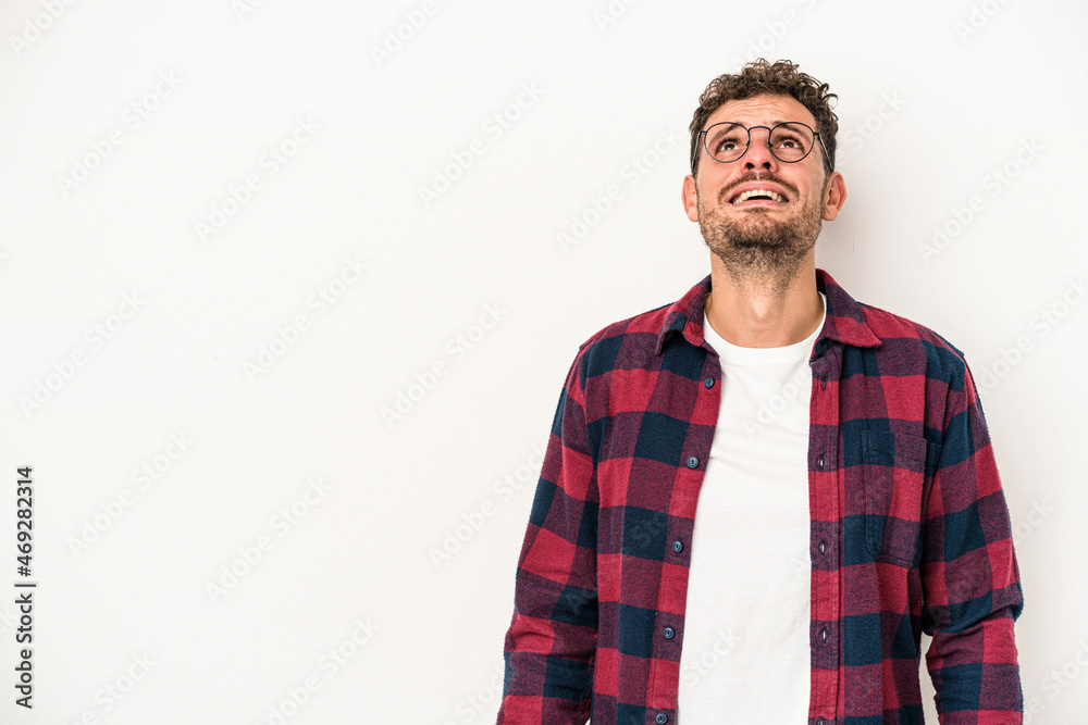 Young caucasian man isolated on white background shouting very angry, rage concept, frustrated. Young caucasian man isolated on white background shouting very angry, rage concept, frustrated.