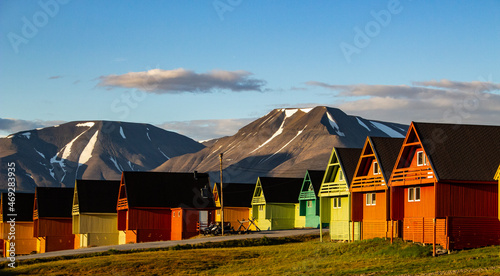 Colorful houses in Longyearbyen, Svalbard, and the landscape behind it. photo