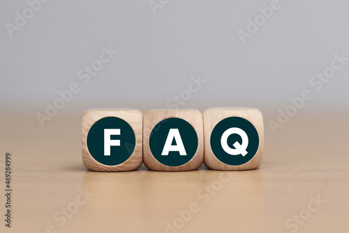 Wooden cube with FAQ text, business concept © Sai