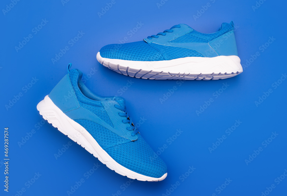 shoes on blue background. shoe store. shopping concept. footwear for training. shoes on blue background. shoe store. shopping concept. footwear for training.