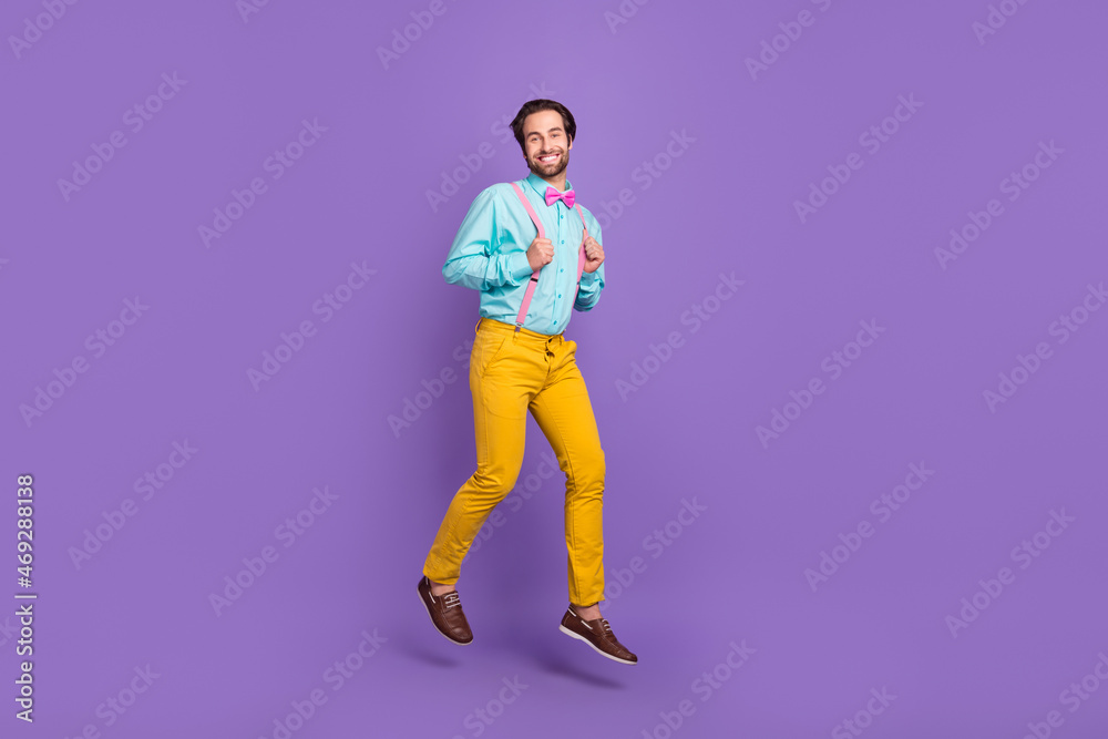 Full body photo of funky young guy run wear tie suspenders shirt trousers footwear isolated on purple background