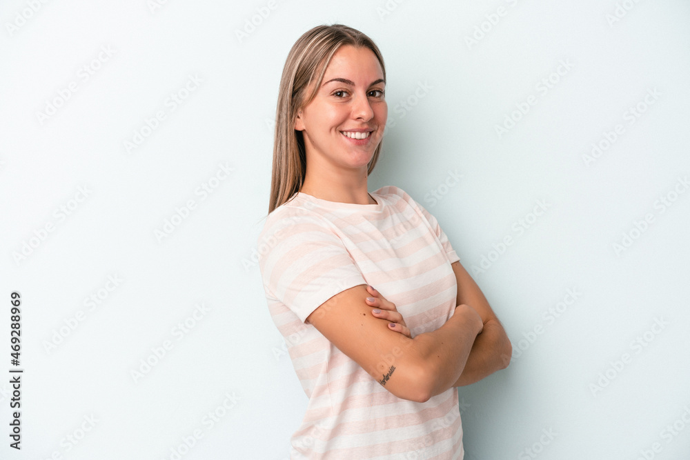 Young caucasian woman isolated on blue background happy, smiling and cheerful. Young caucasian woman isolated on blue background happy, smiling and cheerful.