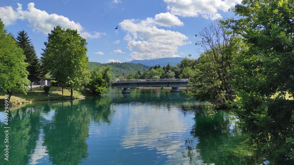 Beautiful river Una in the center of Bihać, Bosnia and Herzegovina. Reflection in the river Una. Beautiful river Una in the center of Bihać, Bosnia and Herzegovina. Reflection in the river Una.