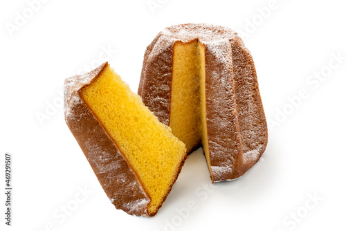 Pandoro cut with slice, traditional Italian Christmas cake with icing sugar isolated on white photo