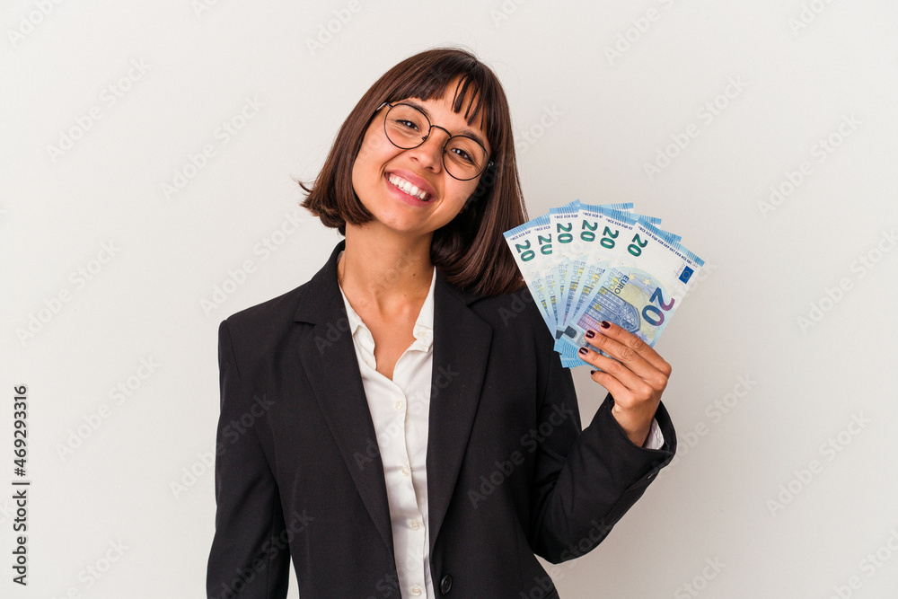 Young mixed race business woman holding a banknotes isolated on white background happy, smiling and cheerful. Young mixed race business woman holding a banknotes isolated on white background happy, smiling and cheerful.