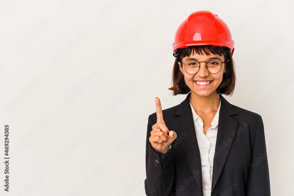 Young architect woman with red helmet isolated on white background showing number one with finger. Young architect woman with red helmet isolated on white background showing number one with finger.