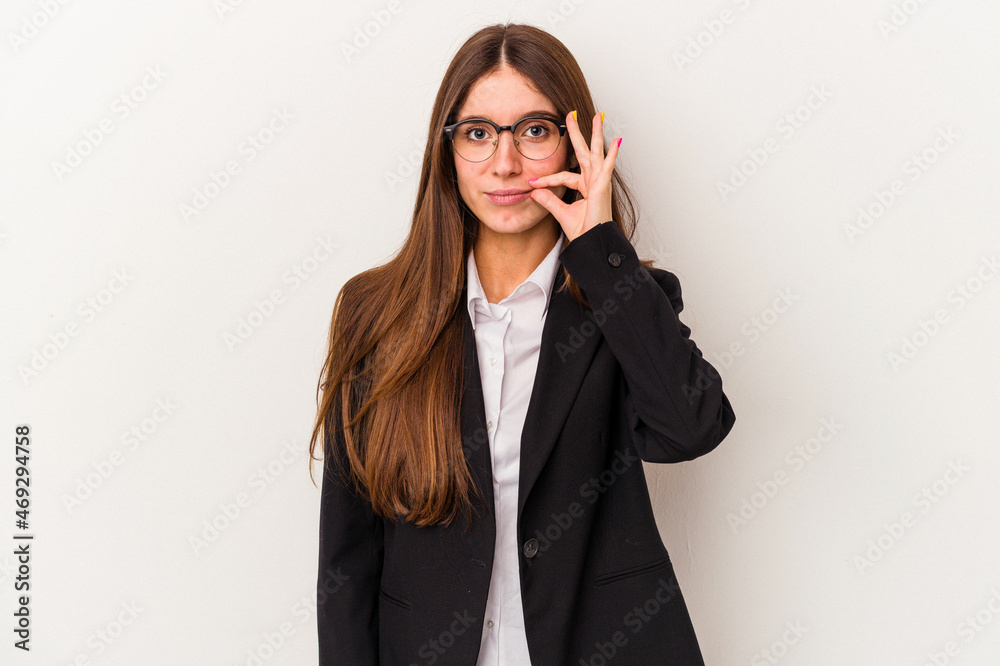 Young caucasian business woman isolated on white background with fingers on lips keeping a secret.