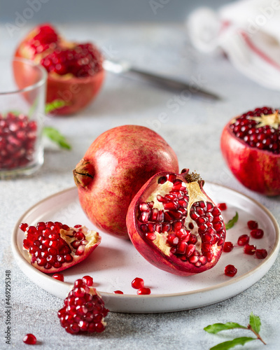 Juicy pomegranates on a ceramic plate © Ekaterina
