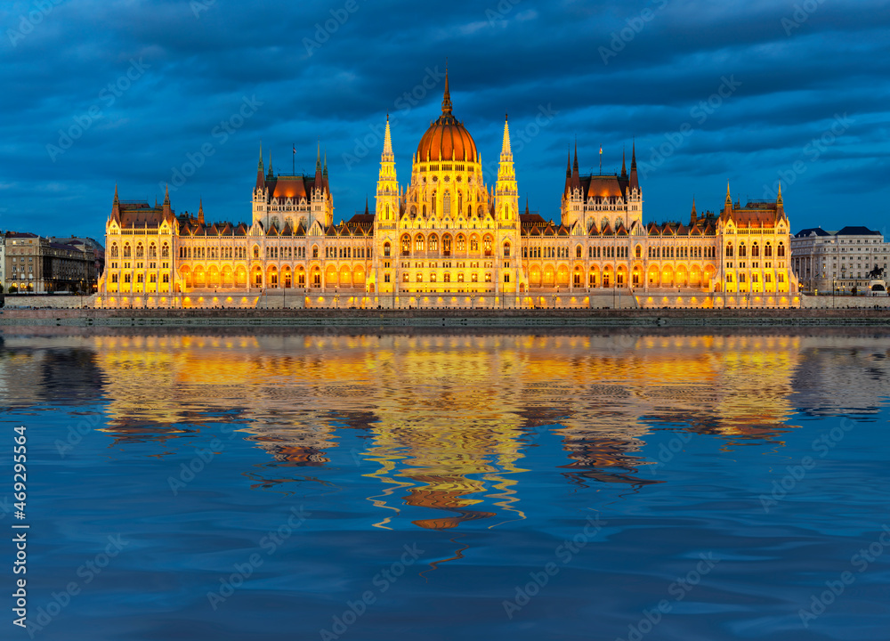 Hungarian Parliament building at sunset with reflection in Danube river, Budapest, Hungary
