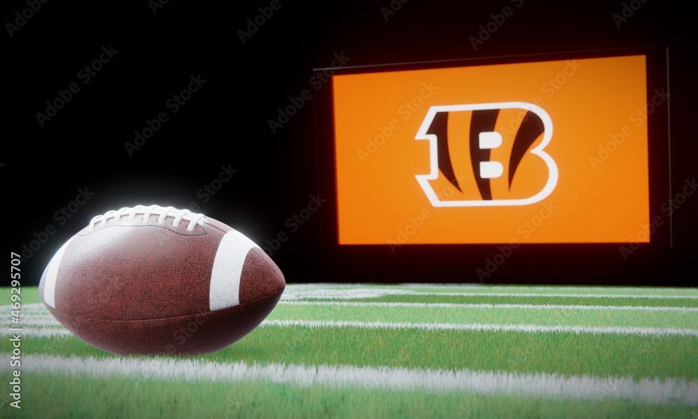 American football in foreground with logo of NFL team Cincinnati Bengals  projected on screen in background. Editorial 3D illustration Stock  Illustration
