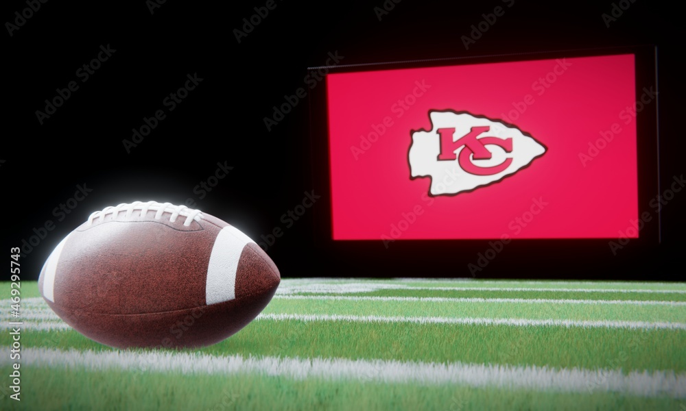 American football in foreground with logo of NFL team Kansas City Chiefs  projected on screen in background. Editorial 3D illustration Stock  Illustration