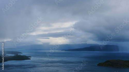 dark rain clouds over fjord in Norway