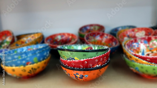 Traditional bulgarian products for sale. Hand made bowls in different colours. Selective focus, panoramic view