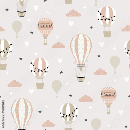 Pink hot air ballon and clouds seamless childish pattern. Hand drawn repeat pattern for wrapping, fabrik, textile or paper projects. Vector illustration.