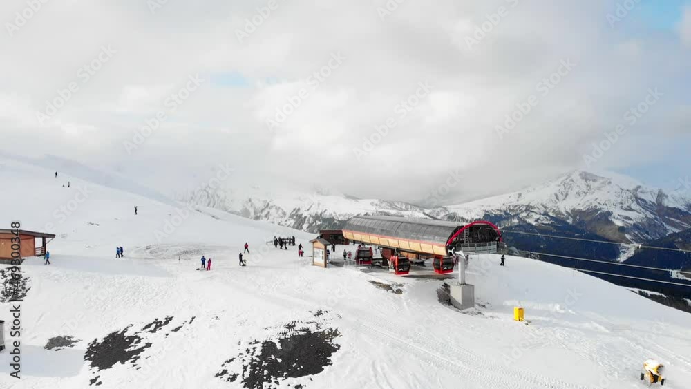 Ski lift in mountain resort. Ski resort chairlift gondola on steep mountain ski slopes. Ski lift in mountain resort. Ski resort chairlift gondola on steep mountain ski slopes.