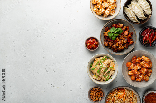 Photography chinese food, chinese traditional cuisine dishes on a light concrete background,