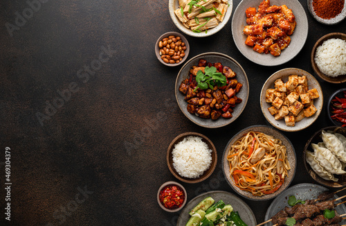chinese food, chinese traditional cuisine dishes on dark background, top view, copy space