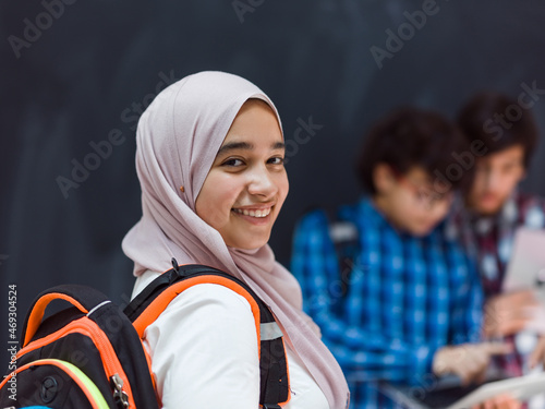 Canvas Print Modern arab teens use smartphone, tablet and latpop to study during online class