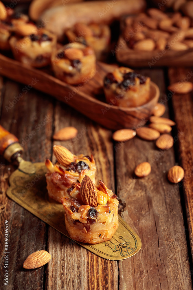 Small cakes with almonds, raisins, and honey. Small cakes with almonds, raisins, and honey.