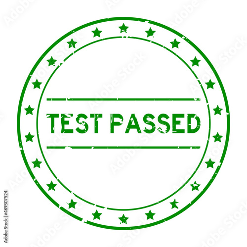 Grunge green test passed word round rubber seal stamp on white background
