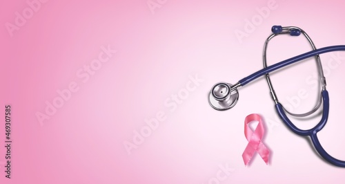 Pink ribbon and stethoscope on pastel background, Symbol of womens breast cancer