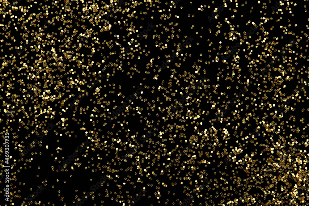 Gold glitter confetti abstract background, luxury New Year backdrop with golden dust.