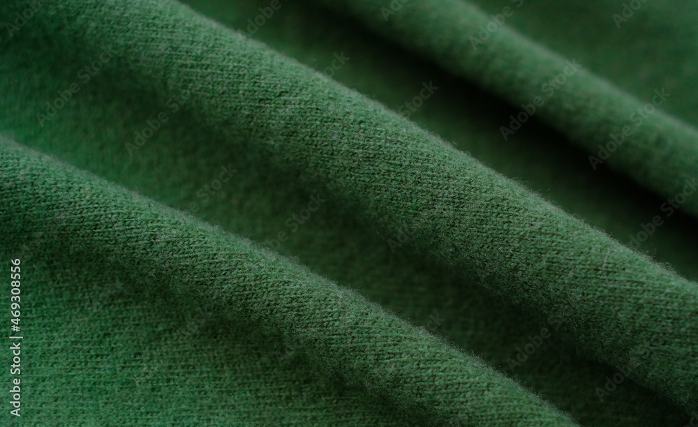 Green woolen natural texture, knitted textile background