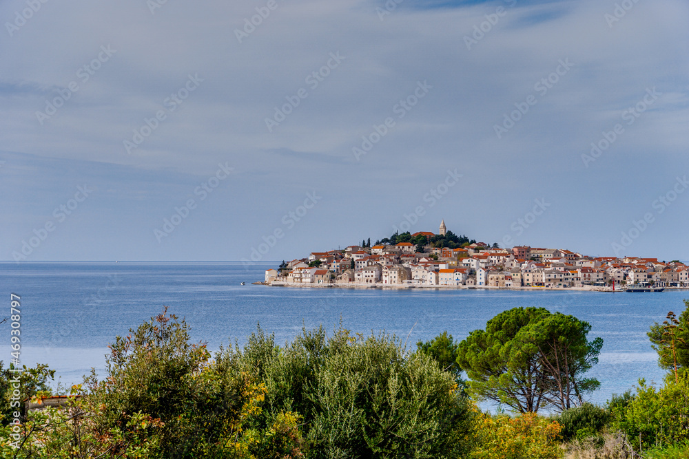 view of the idyllic village of Primosten in Croatia and the coast of the Adriatic Sea
