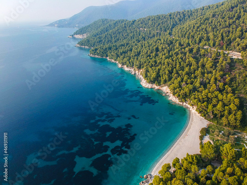 Aerial panoramic view over Milia beach in Skopelos island, against a cloudy sky in Sporades, Greece photo