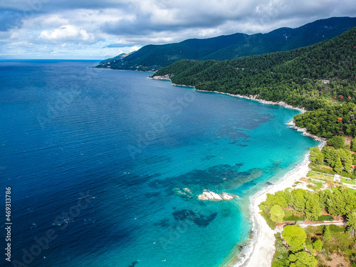 Aerial panoramic view over Milia beach in Skopelos island  against a cloudy sky in Sporades  Greece