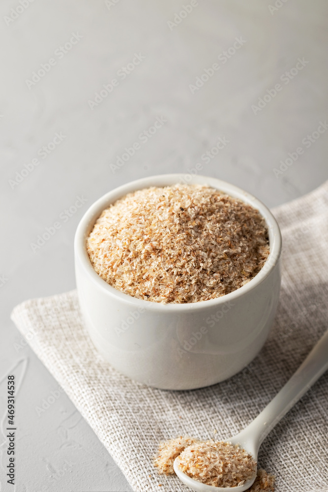 A pile of psyllium husks in a bowl on the table. Dietary supplement, superfood. Copy space A pile of psyllium husks in a bowl on the table. Dietary supplement, superfood. Copy space