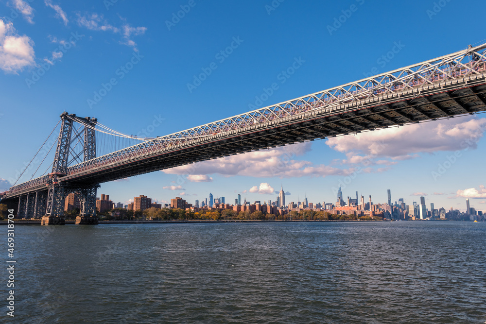 A photograph of a bridge in New York City taken during the day from the Circle Line Cruise