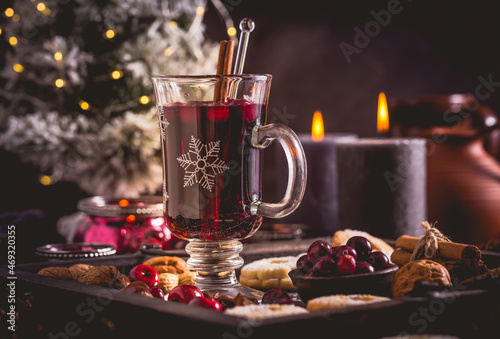 Mulled wine with cranberry and spices  Christmas cookies and candles