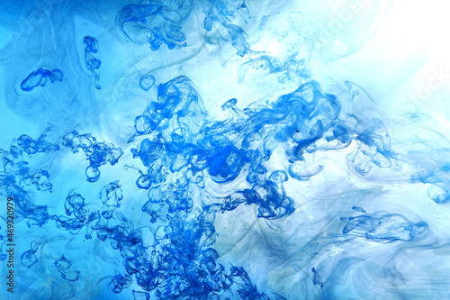 Blue smoke on white ink background, colorful fog, abstract swirling ocean sea, acrylic paint pigment underwater © amixstudio