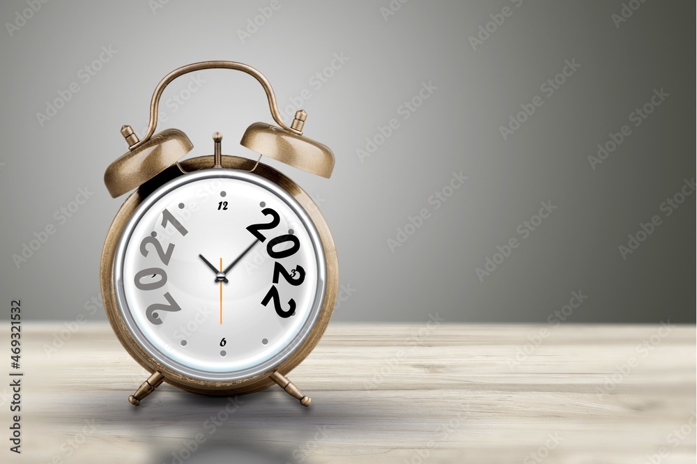 2021 and 2022 on the alarm clock. Merry Christmas and Happy new year concept. 2021 and 2022 on the alarm clock. Merry Christmas and Happy new year concept.